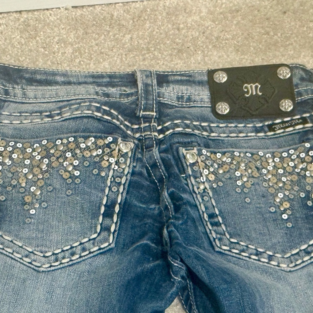 Buckle Skinny Jeans